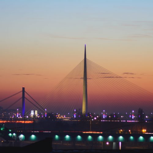 Ada bridge on Sava river at sunset. Modern design and architecture.